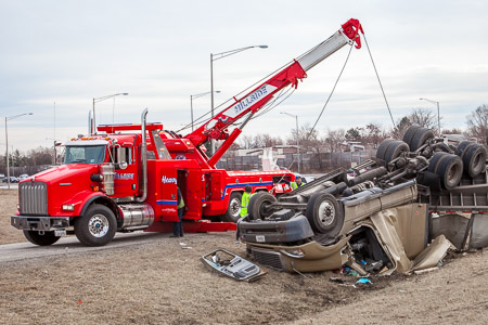 Hillside Towing Company uprighting an overturned tractor-trailer and recovering steel coils 3-18-15 near Long Grove IL Larry Shapiro photographer shapirophotography.net